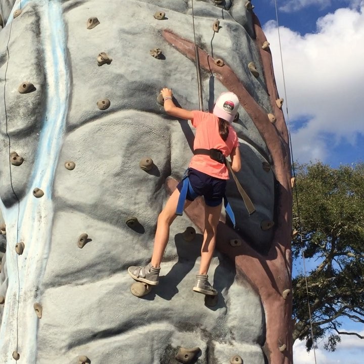 At the Kids Zone at the R.V. Show in Tampa, Hannah quickly climbed all the routes on the climbing wall, including the hardest one. •