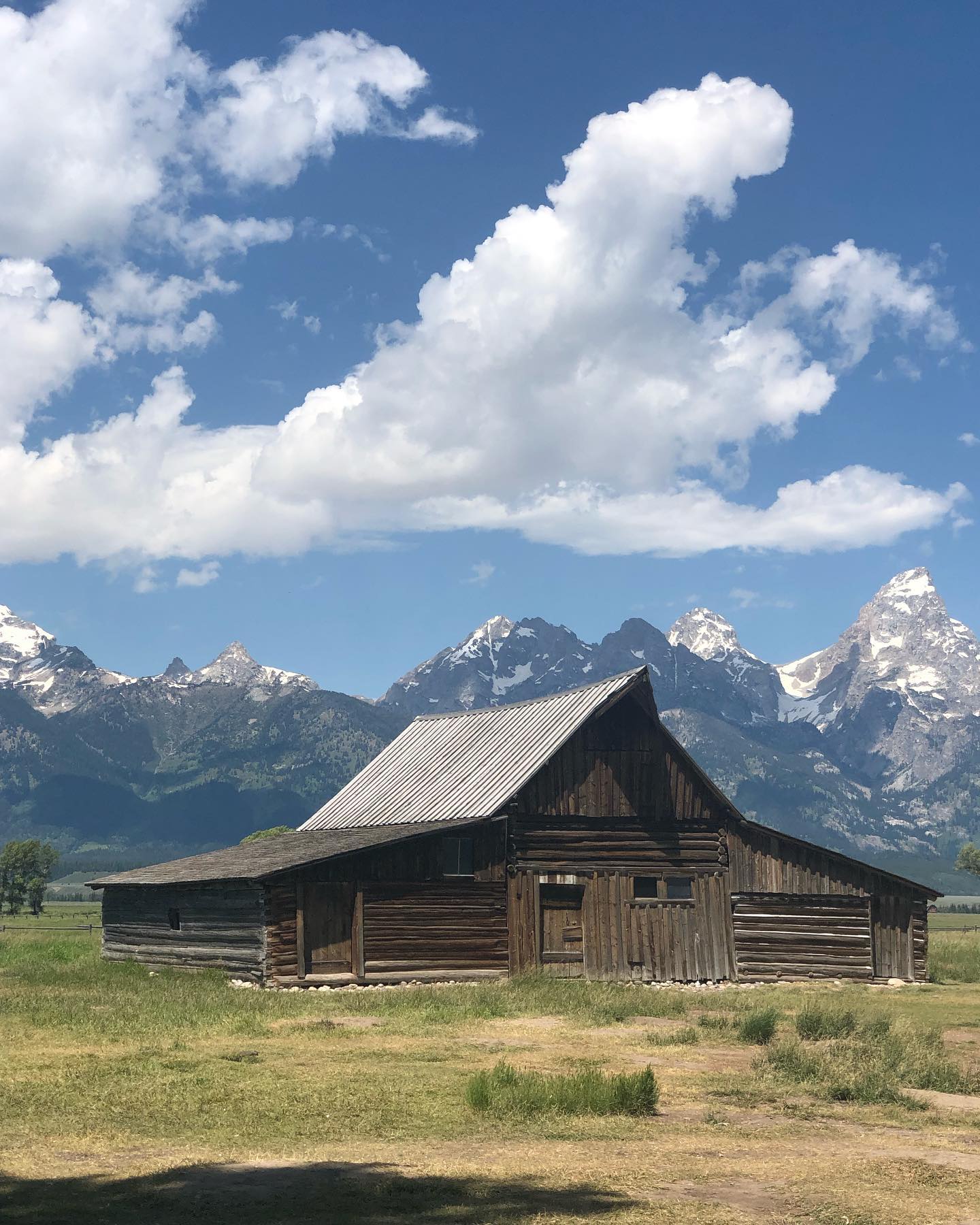 Iconic Picture of Mormon Row . • What would a trip to @grandtetonnps be without stopping and taking a picture of the Moulton Barn on Mormon Row? • It’s so fun to finally visit places we’ve seen a million times on the internet. So grateful for the chance to get to travel and see all this beauty with our own eyes. ️ •